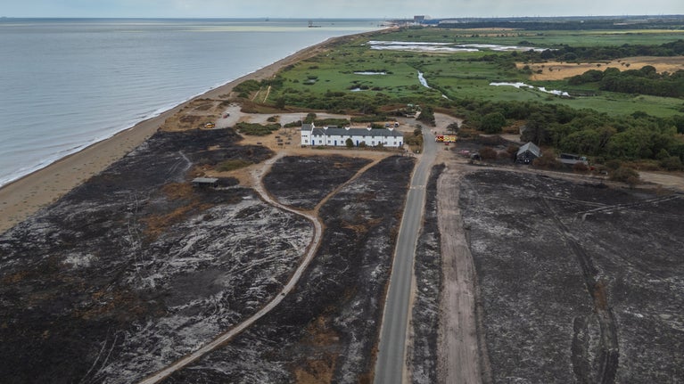 Aerial shot of fire damage on the lead up to Coastguard Cottages at Dunwich Heath, Suffolk